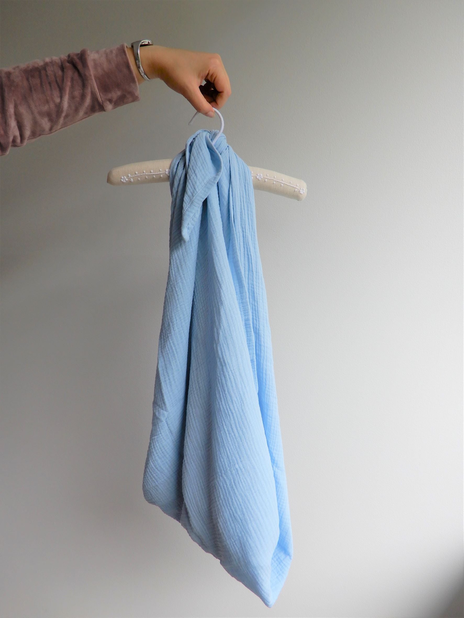 Blue muslin wrap hung