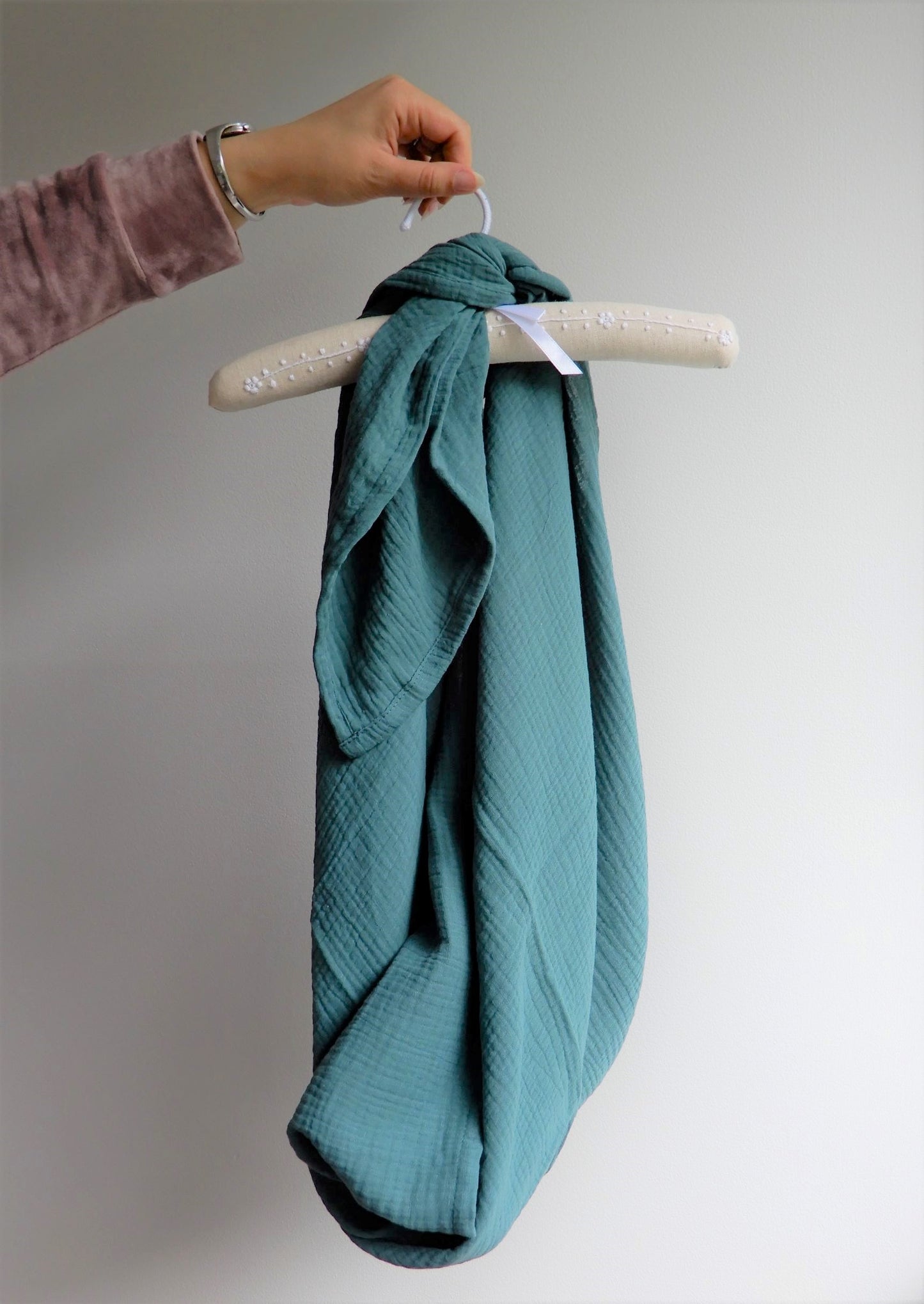 Green muslin wrap hung