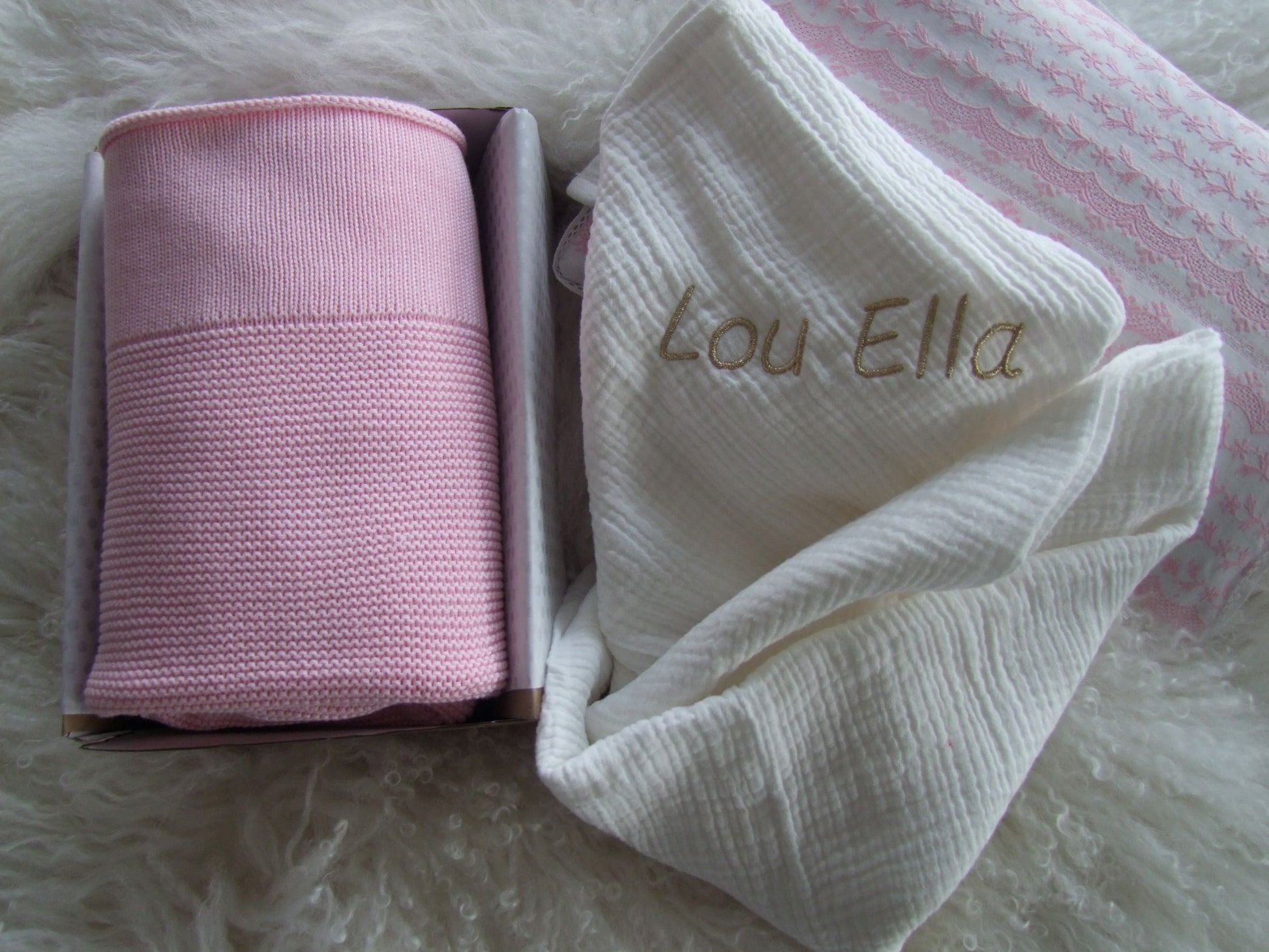 Pink baby knit blanket paired with pink muslin wrap. Both can be personalised to your liking and boxed for delivery.