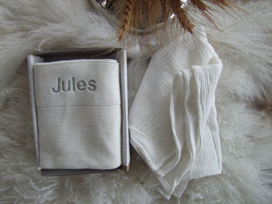 White baby knit blanket paired with white muslin wrap. Both can be personalised to your liking and boxed for delivery.